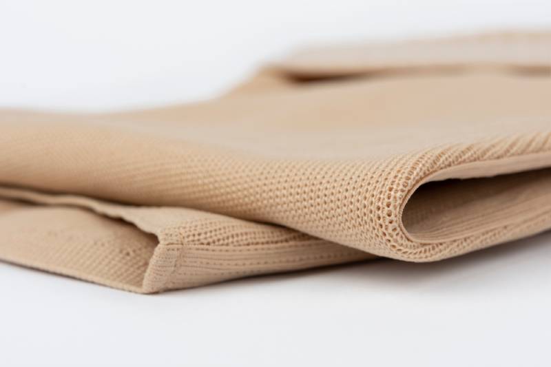 An innovative flat-knit compression garment for lymphoedema patients led to better outcomes: a multicentre study